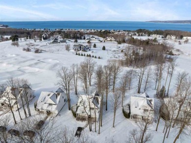 Offering Lake Michigan views, this fully furnished charming on Crooked Tree Golf Club in Michigan - for sale on GolfHomes.com, golf home, golf lot