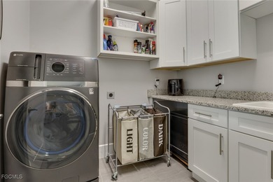 Discover modern coastal living in this Beautiful custom Home on Burnt Store Golf Club in Florida - for sale on GolfHomes.com, golf home, golf lot