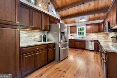 This is a light and bright, fully renovated, real log cabin in on Big Canoe Golf Club - Cherokee in Georgia - for sale on GolfHomes.com, golf home, golf lot