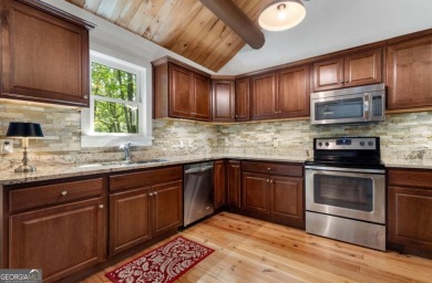This is a light and bright, fully renovated, real log cabin in on Big Canoe Golf Club - Cherokee in Georgia - for sale on GolfHomes.com, golf home, golf lot