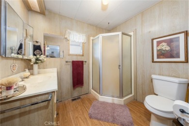 Great manufactured home sitting elevated up on the golf course on Arroyo Fairways Club and Golf Course in California - for sale on GolfHomes.com, golf home, golf lot