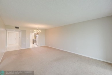 A beautiful lake view 2/2 unit on the top 4th floor located in on Flamingo Lakes Country Club in Florida - for sale on GolfHomes.com, golf home, golf lot
