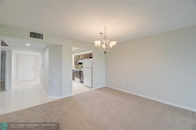 A beautiful lake view 2/2 unit on the top 4th floor located in on Flamingo Lakes Country Club in Florida - for sale on GolfHomes.com, golf home, golf lot