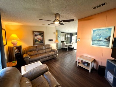 Discover your ideal retreat with this meticulously designed on Lake Henry Golf Club in Florida - for sale on GolfHomes.com, golf home, golf lot