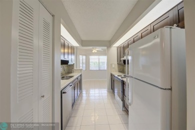A beautiful lake view 2/2 unit on the top 4th floor located in on Flamingo Lakes Country Club in Florida - for sale on GolfHomes.com, golf home, golf lot