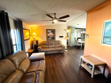 Discover your ideal retreat with this meticulously designed on Lake Henry Golf Club in Florida - for sale on GolfHomes.com, golf home, golf lot