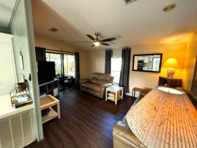 Discover your ideal retreat with this meticulously designed on Lake Henry Golf Club in Florida - for sale on GolfHomes.com, golf home, golf lot