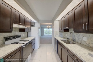 A beautiful lake view 2/2 unit on the top 4th floor located in on Flamingo Lakes Country Club in Florida - for sale on GolfHomes.com, golf home, golf lot