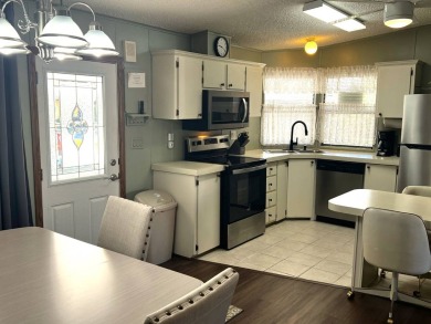 Discover your ideal retreat with this meticulously designed on Lake Henry Golf Club in Florida - for sale on GolfHomes.com, golf home, golf lot