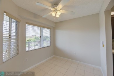 A beautiful lake view 2/2 unit on the top 4th floor located in on Flamingo Lakes Country Club in Florida - for sale on GolfHomes.com, golf home, golf lot