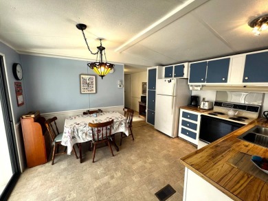 Discover your ideal retreat with this meticulously designed on Lake Henry Golf Club in Florida - for sale on GolfHomes.com, golf home, golf lot