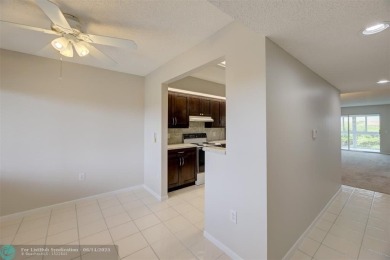 A beautiful lake view 2/2 unit on the top 4th floor located in on Flamingo Lakes Country Club in Florida - for sale on GolfHomes.com, golf home, golf lot