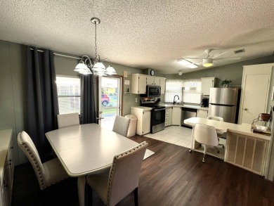 Discover your ideal retreat with this meticulously designed on Lake Henry Golf Club in Florida - for sale on GolfHomes.com, golf home, golf lot