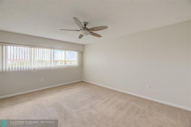 A beautiful lake view 2/2 unit on the top 4th floor located in on Flamingo Lakes Country Club in Florida - for sale on GolfHomes.com, golf home, golf lot