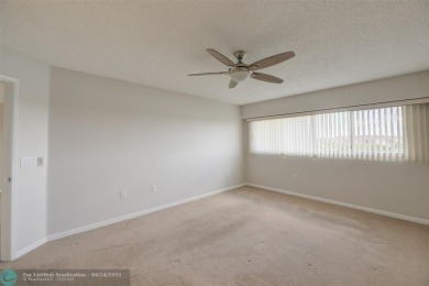 A beautiful lake view 2/2 unit on the top 4th floor located in on Flamingo Lakes Country Club in Florida - for sale on GolfHomes.com, golf home, golf lot