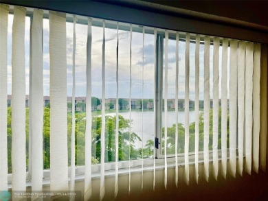 A beautiful lake view 2/2 unit on the top 4th floor located in on Flamingo Lakes Country Club in Florida - for sale on GolfHomes.com, golf home, golf lot