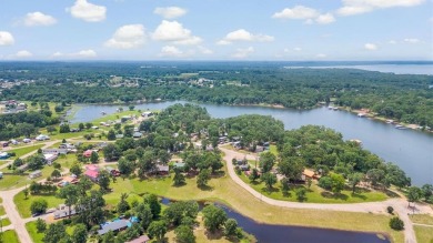Sit back on your covered porch and soak in the breathtaking on Links At Lands End in Texas - for sale on GolfHomes.com, golf home, golf lot