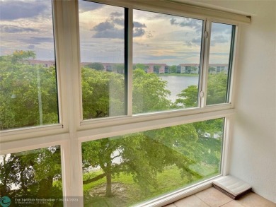 A beautiful lake view 2/2 unit on the top 4th floor located in on Flamingo Lakes Country Club in Florida - for sale on GolfHomes.com, golf home, golf lot