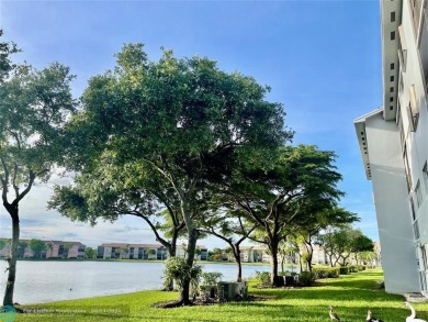 A beautiful lake view 2/2 unit on the top 4th floor located in on Flamingo Lakes Country Club in Florida - for sale on GolfHomes.com, golf home, golf lot