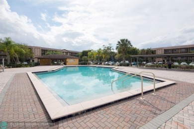 A beautiful lake view 2/2 unit on the top 4th floor located in on Flamingo Lakes Country Club in Florida - for sale on GolfHomes.com, golf home, golf lot
