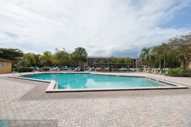 A beautiful lake view 2/2 unit on the top 4th floor located in on Flamingo Lakes Country Club in Florida - for sale on GolfHomes.com, golf home, golf lot