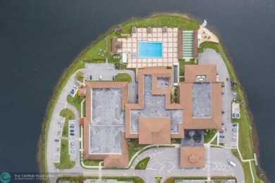 A beautiful lake view 2/2 unit on the top 4th floor located in on Flamingo Lakes Country Club in Florida - for sale on GolfHomes.com, golf home, golf lot