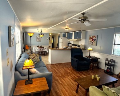 This charming home features two bedrooms and one and a half on Lake Henry Golf Club in Florida - for sale on GolfHomes.com, golf home, golf lot
