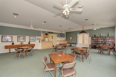 Appealing two bedroom, plus den, two bath condo with a two car on Capri Isle Golf Club in Florida - for sale on GolfHomes.com, golf home, golf lot