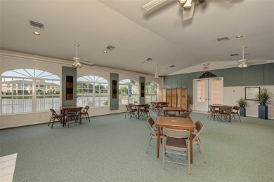 Appealing two bedroom, plus den, two bath condo with a two car on Capri Isle Golf Club in Florida - for sale on GolfHomes.com, golf home, golf lot