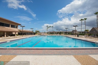 A beautiful lake view 2/2 unit on the top 4th floor located in on Flamingo Lakes Country Club in Florida - for sale on GolfHomes.com, golf home, golf lot