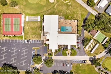 This 3 bedroom, 2 bath property is a lovely place to call homee on Brookridge Country Club in Florida - for sale on GolfHomes.com, golf home, golf lot