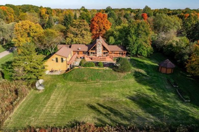 This stunning property offers the perfect blend of luxury and on Hickory Creek Golf Course in Michigan - for sale on GolfHomes.com, golf home, golf lot