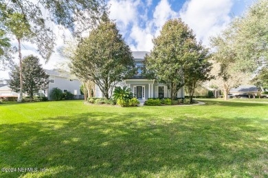 This elegant two story sits on a spectacular half-acre corner on St. Johns Golf and Country Club in Florida - for sale on GolfHomes.com, golf home, golf lot