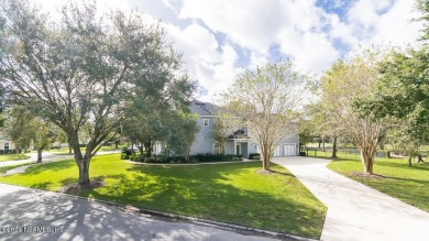 This elegant two story sits on a spectacular half-acre corner on St. Johns Golf and Country Club in Florida - for sale on GolfHomes.com, golf home, golf lot