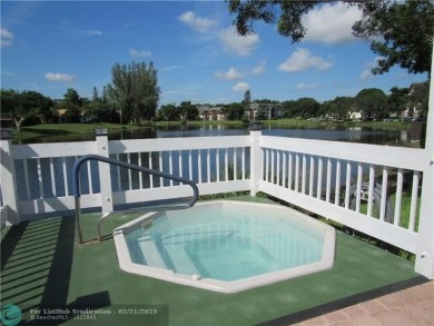 Nestled in a highly desirable International Village, this cozy on Inverrary Country Club in Florida - for sale on GolfHomes.com, golf home, golf lot