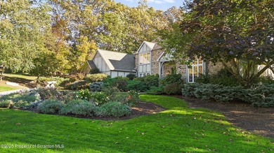 Welcome to this architecturally striking Tudor-inspired on Glenmaura National Golf Club in Pennsylvania - for sale on GolfHomes.com, golf home, golf lot