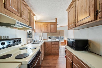 American Condominium - Your Perfect Winter Retreat or Forever on The Links of Lake Bernadette in Florida - for sale on GolfHomes.com, golf home, golf lot