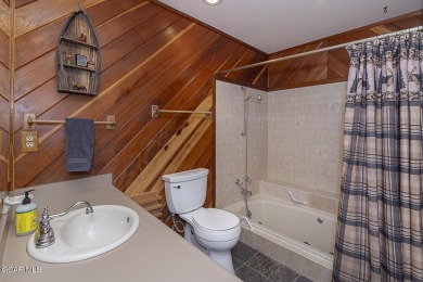 Rustic Cabin Retreat with Lake & Mountain Views in Columbine on Grand Lake Golf Course in Colorado - for sale on GolfHomes.com, golf home, golf lot