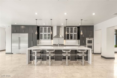 Tucked behind the gates of MacDonald Highlands, this exquisite on Dragon Ridge Country Club in Nevada - for sale on GolfHomes.com, golf home, golf lot