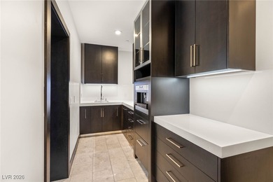 Tucked behind the gates of MacDonald Highlands, this exquisite on Dragon Ridge Country Club in Nevada - for sale on GolfHomes.com, golf home, golf lot