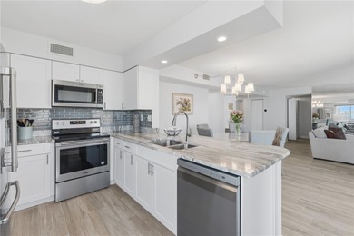 Enjoy sweeping open water views of Boca Ciega Bay from this on Isla Del Sol Yacht and Country Club in Florida - for sale on GolfHomes.com, golf home, golf lot