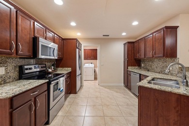 Welcome to this mint-condition 3-bedroom, 2-bath home in the on Spanish Lakes Fairways in Florida - for sale on GolfHomes.com, golf home, golf lot