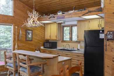 Rustic Cabin Retreat with Lake & Mountain Views in Columbine on Grand Lake Golf Course in Colorado - for sale on GolfHomes.com, golf home, golf lot
