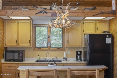 Rustic Cabin Retreat with Lake & Mountain Views in Columbine on Grand Lake Golf Course in Colorado - for sale on GolfHomes.com, golf home, golf lot