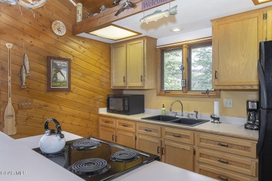 Rustic Cabin Retreat with Lake & Mountain Views in Columbine on Grand Lake Golf Course in Colorado - for sale on GolfHomes.com, golf home, golf lot