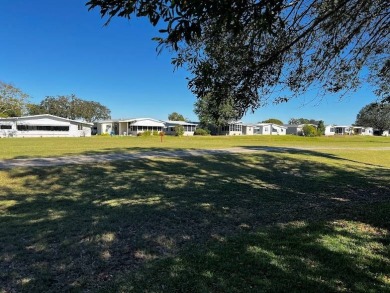 This approx 1200 sf 1990 2 bedroom 2 bath home is located in the on Lake Henry Golf Club in Florida - for sale on GolfHomes.com, golf home, golf lot