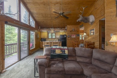 Rustic Cabin Retreat with Lake & Mountain Views in Columbine on Grand Lake Golf Course in Colorado - for sale on GolfHomes.com, golf home, golf lot