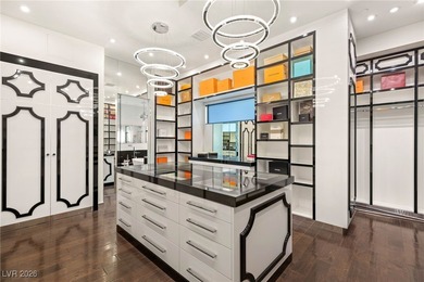 Tucked behind the gates of MacDonald Highlands, this exquisite on Dragon Ridge Country Club in Nevada - for sale on GolfHomes.com, golf home, golf lot