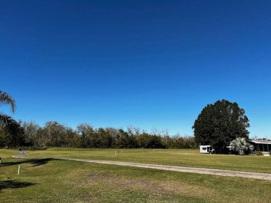 This approx 1200 sf 1990 2 bedroom 2 bath home is located in the on Lake Henry Golf Club in Florida - for sale on GolfHomes.com, golf home, golf lot