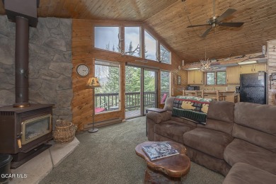 Rustic Cabin Retreat with Lake & Mountain Views in Columbine on Grand Lake Golf Course in Colorado - for sale on GolfHomes.com, golf home, golf lot